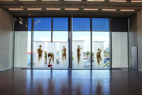 Oscar Muñoz. Cortinas de baño, 1994. Acrylic on plastic, 74 x 28 1/2 inches, each curtain; 5 curtains. Installation view Pérez Art Museum Miami. Collection Pérez Art Museum Miami, gift of George M. Safirstein M. D. and Pola Reydburd.