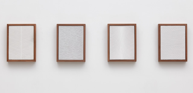 Anthony Pearson. Untitled (Four Part Etched Plaster), 2015. Pigmented hydrocal and medium coated pigmented hydrocal in walnut frames, each: 31.8 x 24.1 x 4.4 cm (12 1/2 x 9 1/2 x 1 3/4 in). Courtesy of the artist and Marianne Boesky Gallery, New York. © Anthony Pearson. Photograph: Lee Thompson.