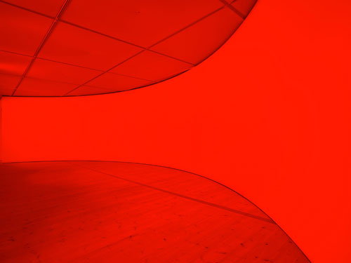 Gail Pickering. She was a Visitor, 2014. Installation view. Architectural installation incorporating cyclorama wall, red lights. Courtesy of the artist and BALTIC. © Gail Pickering. Photograph: John McKenzie.