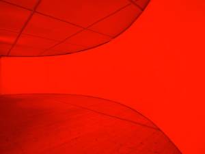 Gail Pickering. She was a Visitor, 2014. Installation view. Architectural installation incorporating cyclorama wall, red lights. Courtesy of the artist and BALTIC. © Gail Pickering. Photograph: John McKenzie.
