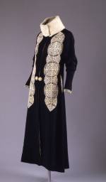 Paul Poiret (French, 1879–1944). Coat, ca. 1919. Black silk and wool rep weave with white kid cutwork appliqué and white broadtail trim. The Metropolitan Museum of Art, Gift of Mrs. David J. Colton, 1961