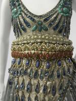 Paul Poiret (French, 1879-1944). Fancy Dress Costume, 1911. Seafoam green silk gauze, silver lamé, blue foil and blue and silver coiled cellophane cord appliqué, and blue, silver, coral, pink, and turquoise cellulose beading. The Metropolitan Museum of Art, Purchase, Irene Lewisohn Bequest, 1983 