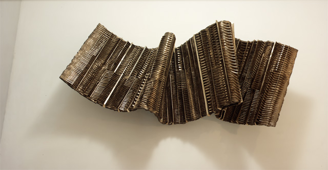 Arnaldo Pomodoro. Papyrus, 1984. Bronze, 86 x 225 x 28 cm. Photograph: Paolo Mussat Sartor.