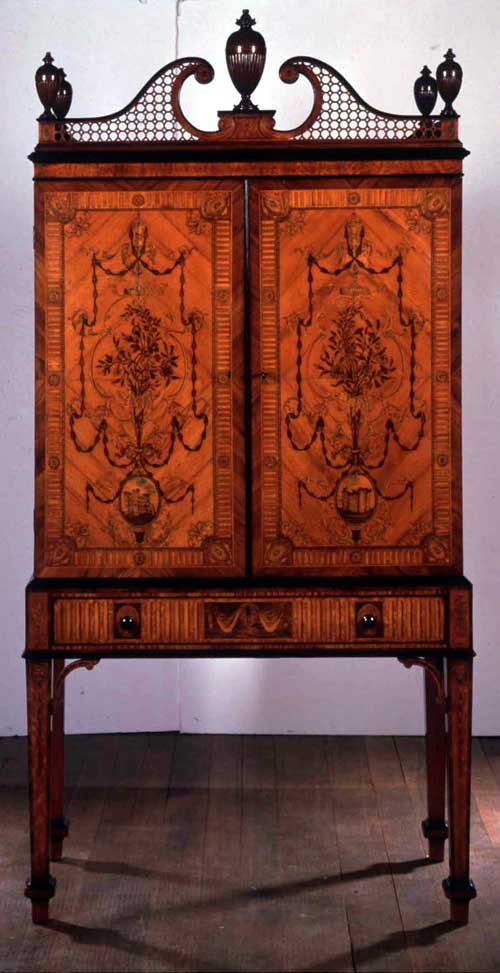 Ince and Mayhew Cabinet and stand, c.1775. Satinwood with marquetry in engraved, stained and shaded woods, the drawer fronts crossbanded with tulipwood and ebony mouldings 103 x 51 x 213 cm © 2003 Collection Lord Lloyd-Webber