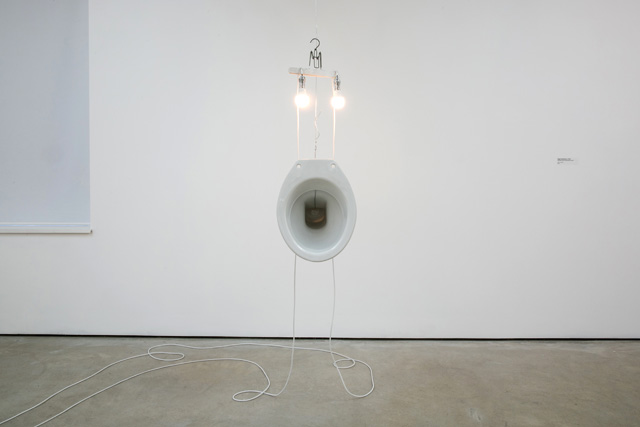 Sarah Lucas. Magi, 2012. Coat hanger, lightbulbs, steel wire, electric cable, toilet bowl. Photo © Pete Jones.