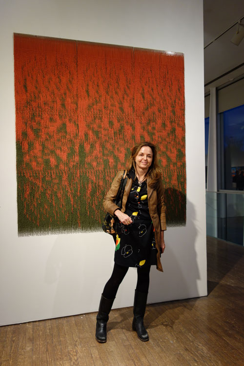 Alice Hope and her chains work Untitled, 2013. Aluminum ball chain on perforated aluminium panel, 6 x 6 feet. Photograph: Miguel Benavides.