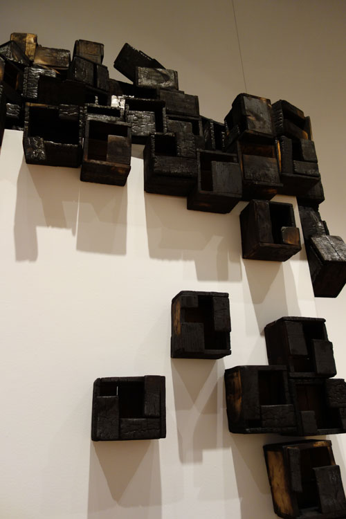 Roberto Diago. Ciudad en ascenso (Ascending City), 2009. Charred wood installation. Photograph: Miguel Benavides.