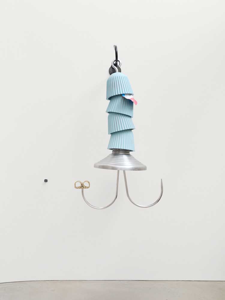 Magali Reus, Rig (Crown Caps), 2025. Waxed, painted and sanded polyester; forged, brushed, blackened and oiled steel bar; forged, mirror-polished and oiled aluminium bar; sand-cast, engraved aluminium; brushed, sand-cast brass; airbrushed aluminium foil. 149 x 76.5 x 61.5 cm. Installation view at The Perimeter. © Magali Reus. All works courtesy of the Artist, The Approach, London; Tanya Bonakdar Gallery, NYC, USA; Galerie Greta Meert, Brussels; Mai 36 Galerie, Zurich. Photo: Eva Herzog.