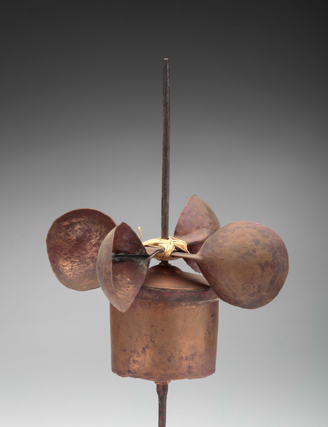 Wind-powered prayer wheel (mani rlung ‘khor), Tibet, before 1920. Metal, ink, paper, bamboo, string. Newark Museum. Photo © Newark Museum.