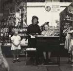 Lee Sievan. <em>Salvation Army Lassie in Front of a Woolworth Store</em>, c1940. Gelatin silver print. The Jewish Museum, New York, Purchase: Horace W. Goldsmith Foundation Fund. © Estate of Lee Sievan.