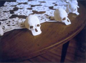 Hildur Bjarnadóttir, <em>Untitled (Skulls)</em>, 1999 (detail). 4 x 54 x 54 in. (5 x 136 x 136 cm.). Crocheted cotton yarn, wood table. Collection of the artist