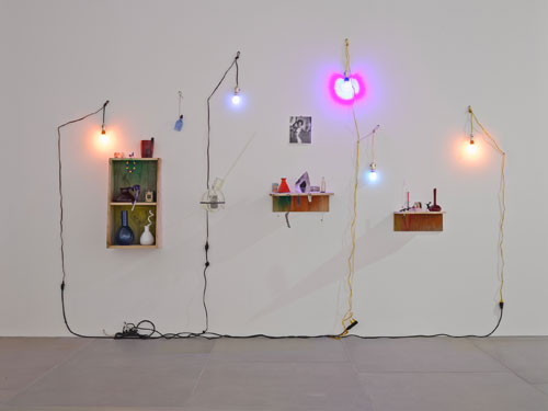 Elias Hansen. Love really had a way of letting us lose ourselves, 2014. Found objects, glass, light bulbs, naked lady cards, photograph, steel, wire, and wood, approx 270 x 410 x 40 cm (106¼ x 161⅜ x 15¾ in). Image courtesy of the artist and Blain|Southern. Photograph: Peter Mallet. © the artist.