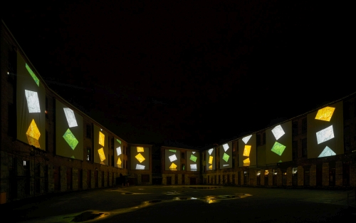 Clifford Ross. Nighttime view of immersive Harmonium Mountain video. Courtyard D. MASS MoCA.