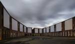 Clifford Ross. Daytime view of immersive Harmonium Mountain video screens. Courtyard D. MASS MoCA.