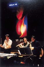 Mark Rowan-Hull. Performance with complementary lighting. Paintings inspired by Messe de la Pentecôte by Olivier Messiaen. Royal Festival Hall 2002.