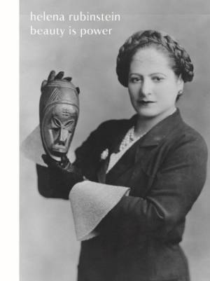 Helena Rubinstein holding one of her masks from the Ivory Coast, 1934. Photograph by George Maillard Kesslere. Helena Rubinstein Foundation Archives, Fashion Institute of Technology, SUNY, Gladys Marcus Library, Special Collections