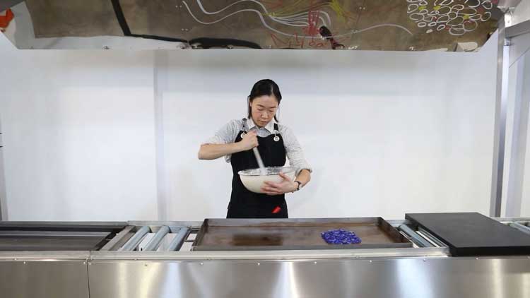 Aki Sasamoto, Grilled Diagrams, Performance, February 2026. Video still. Courtesy of the artist and Studio Voltaire. Video: Dor Even Chen.
