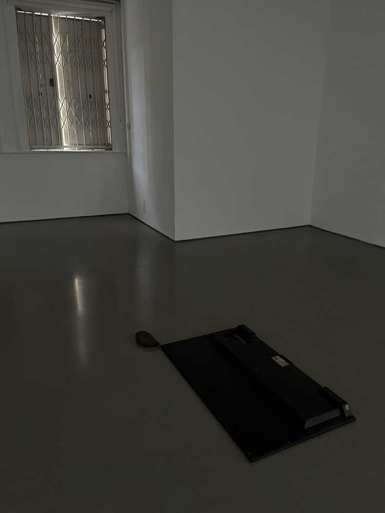 Michael E Smith, Untitled, 2023. Television, rock. Installation view, Henry Moore Institute, Leeds. Photo: Veronica Simpson.