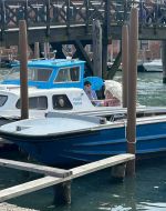 Amie Corry talking to Ásta Fanney Sigurðardóttir onboard a boat at the Venice Biennale 2026.
