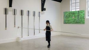 In her first institutional solo show in the UK, Sasamoto creates a freewheeling, haphazard narrative using cooking utensils and ingredients, manoeuvring the audience as she darts about the room