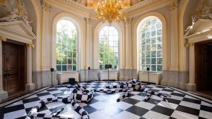 Spilling over floors, walls and balconies, as well as in framed works on walls, artist Libby Heaney’s intervention at Orleans House conjures up the formlessness of quantum physics within the formal constraints of a historical building