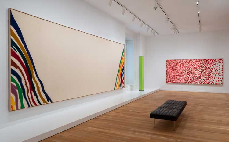 Left: Morris Louis, Beta Upsilon, 1960. Right: Alma Thomas, Red Azaleas Singing and Dancing Rock and Roll Music, 1976. Installation view, American Voices and Visions: Modern and Contemporary Art, Smithsonian American Art Museum.