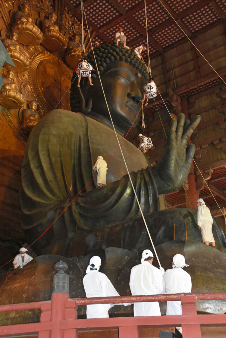 Annual Great Buddha dusting, Todaiji Temple, Nara, Japan, 8th century. Bronze, height c15 m (49 ft). Photo: Photo The Asahi Shimbun / Getty Images.