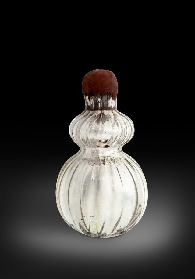 A witch trapped in a bottle, England, c1850. Glass, silver, cork and wax, 110 cm. © Pitt Rivers Museum, University of Oxford.