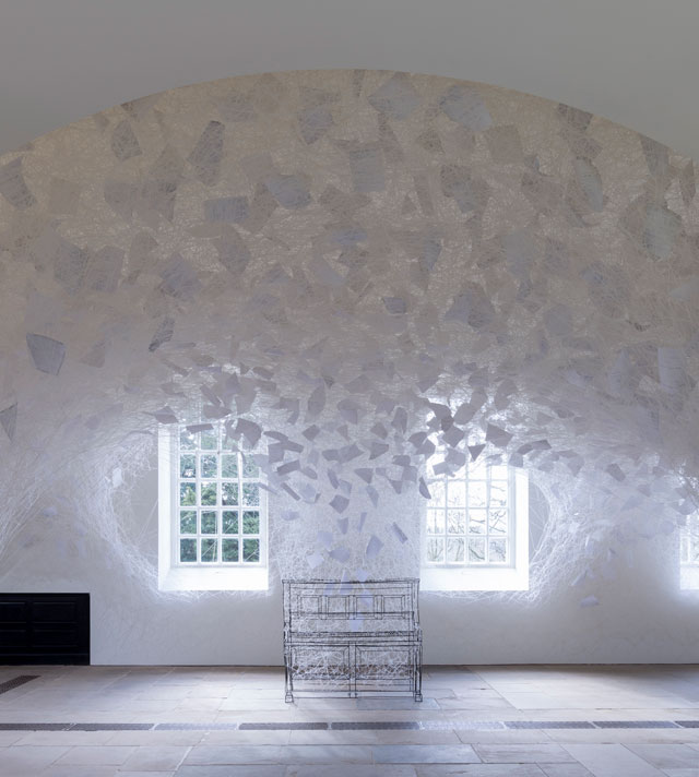 Chiharu Shiota. Beyond Time, 2018. White thread, metal piano, musical notes. Copyright VG Bild-Kunst, Bonn, 2018 and the artist. Courtesy Yorkshire Sculpture Park. Photograph © Jonty Wilde.