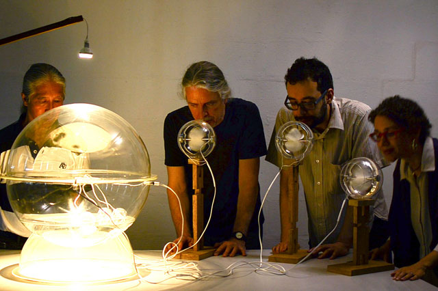 Sopro by Carolina Peres, Cleber Gazana, Daniel Malva, Fábio Oliveira Nunes, Fernando Fogliano, Milton Sogabe, Miriam Steinberg, Rodrigo Dorta Marques and Soraya Braz. Sopro is energized by the audience through the force of them blowing into a propeller which creates electrical energy that is again turned into the movement of tiny motors on water. The artwork is based on the use of a simple technological system: the poetics of the act of blowing and the use of primary scientific principles. This system in progress is conceived parallel to energy and sustainability issues, placing them in post-digital thinking. Photograph: Edilson Ferri.