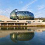 The acoustic auditorium is a latticework dome of glass, aluminium and wood, with a PV sail that follows the sun. Photograph: Didier Boy de la Tour.