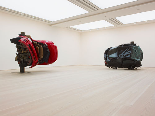 Dirk Skreber. Left: Untitled (Crash 1), 2009. Red Mitsubishi Eclipse Spider 2001, 292.1 x 322.6 x 236.2 cm. Right: <em>Untitled (Crash 2)</em>, 2009. Black Hyundai Tiburon 2001, 231.1 x 315 x 259cm. Courtesy the Saatchi Gallery, London. © Dirk Skreber, 2011. Photo © Stephen White.