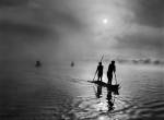 Sebastião Salgado. In the Upper Xingu region of Brazil’s Mato Grosso state, a group of waura fish in the Piulaga Lake near their village. The Upper Xingu Basin is home to an ethnically diverse population. Brazil, 2005. © Sebastião Salgado/Amazonas Images/nbpictures