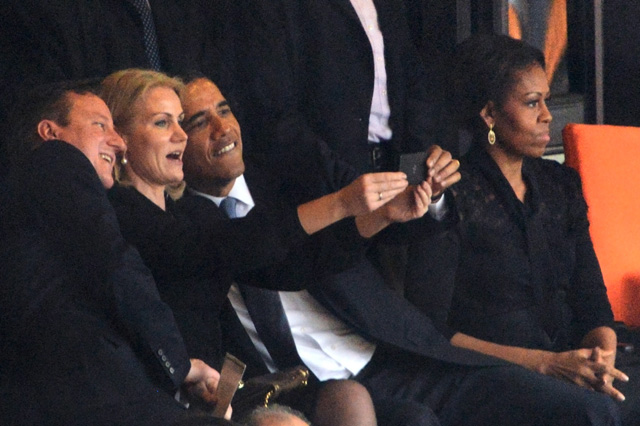 Helle Thorning-Schmidt, the Danish prime minister, took a selfie of herself with President Barack Obama and UK prime minister David Cameron at the Nelson Mandela memorial, December 2013. Courtesy ROBERTO SCHMIDT/AFP/Getty Images.