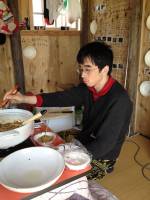 Satoshi Murakami. Every day, Murakami cooked food in his hut and invited curious local people to enter and participate in his daily ritual of eating.