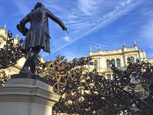 The statue of the RA’s first president, Sir Joshua Reynolds, looks upon Conrad Shawcross' The Dappled Light of the Sun, 2015. Photograph: Martin Kennedy.