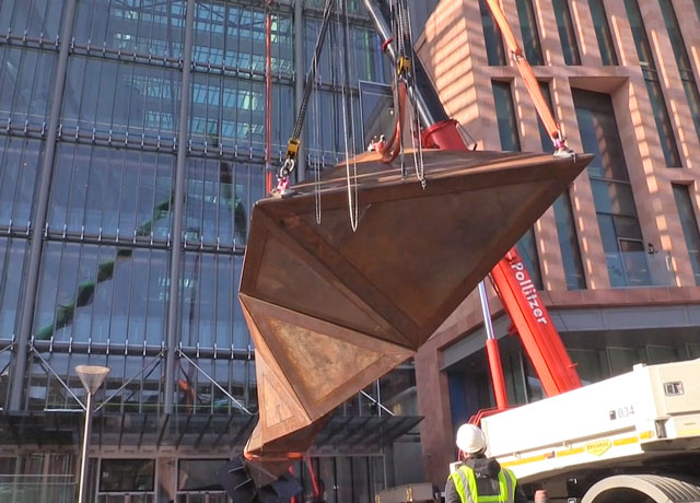 A crane begins the lifting of Paradigm into position outside the Francis Crick Institute, near King’s Cross, London. Photograph: Martin Kennedy.