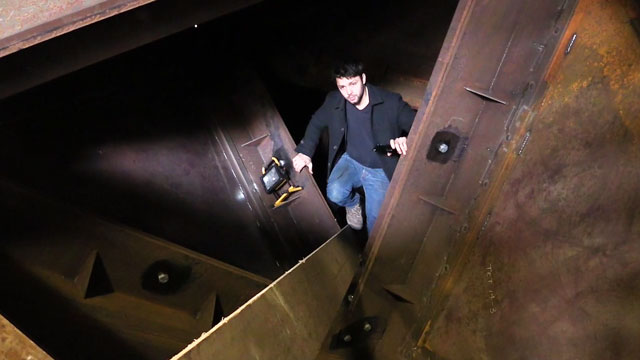 Conrad Shawcross climbs inside Paradigm at the fabricators. Photograph: Martin Kennedy.