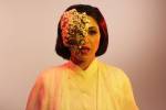 MASK (played by Houda        Echouafni) giving orders to      the aliens.