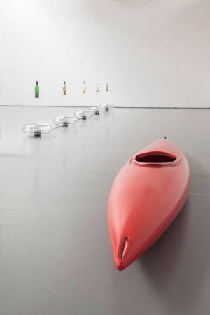 Roman Signer. Bar, 2007 (exhibition copy 2015) and Whisky boat, 2015. Photograph: Ruth Clark, courtesy of Dundee Contemporary Arts.