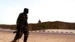 A Malian soldier patrols the reconstructed tombs of Timbuktu, destroyed by extremists in 2012.