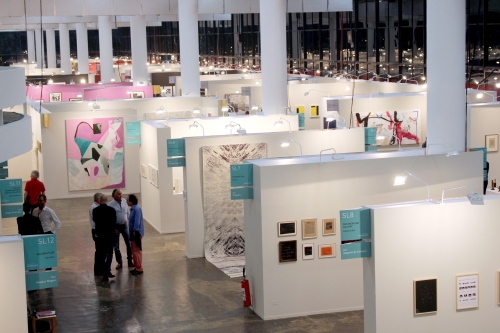 Overview of the Ciccillo Matarazzo pavilion’s ground floor, home to the São Paulo Biennial and SP Arte 2015. Detail: Solo section stands. © German Alfonso Nunez.