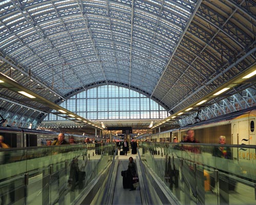 Passengers arrive on the platform on the first day of Eurostar Services operating from the newly restored Barlow Shed at St Pancras International. Photo by Michael Walter/Troika