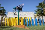 Jessica Stockholder. Installation view: Angled Tangle. Art Basel Miami Beach, 2014. Steel, aluminium, auto paint, light fixtures, plastic bollards, gravel. Site-specific installation. Photograph: Joseph Rynkiewicz. Courtesy of the artist, Kavi Gupta Gallery, and Mitchell-Innes & Nash, NY.