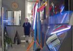 Nanda Vigo in her studio with her work Cronotopo, 1966 and Light tree, 1983. Photograph © Roswitha Pross, Munich.