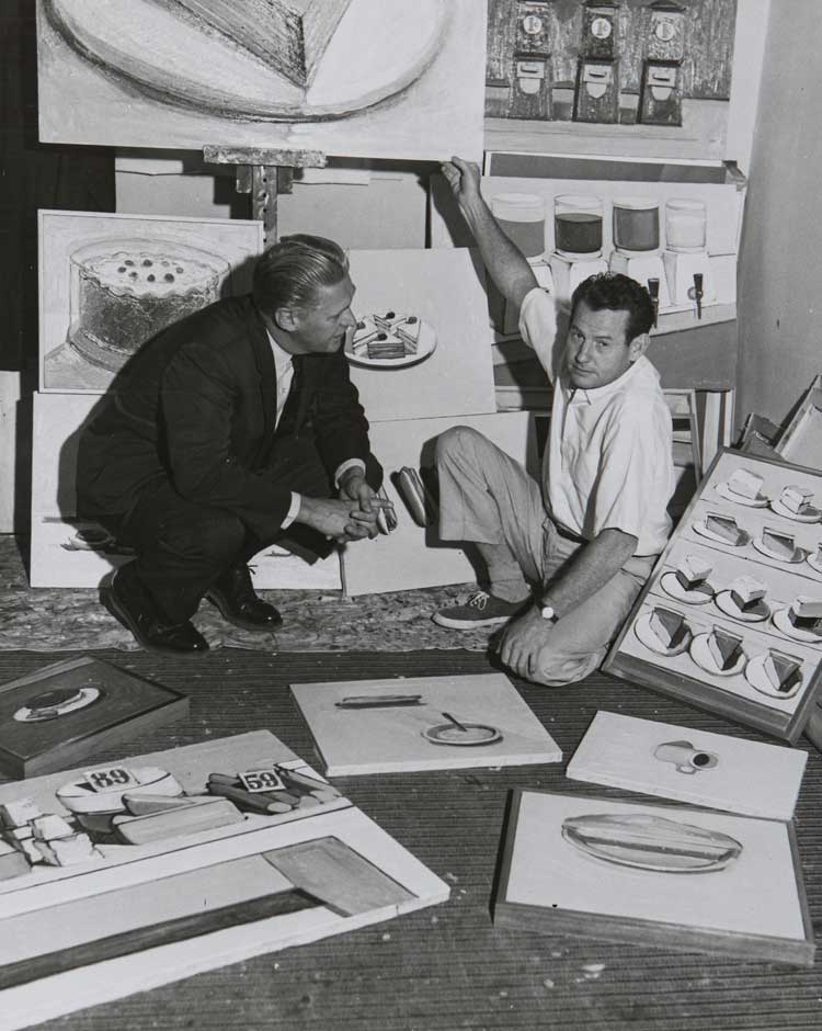Wayne Thiebaud in his studio in Sacramento with Professor Paul Beckmann, 1962. Collection of the Wayne Thiebaud  Foundation. © Wayne Thiebaud / VAGA at ARS, NY and DACS, London 2025.