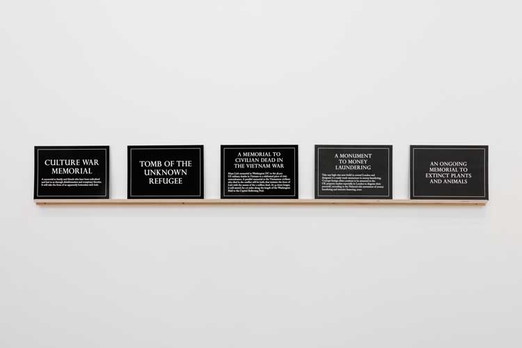Jeremy Deller, Tomb of the Unknown Refugee; An Ongoing Memorial to Extinct Plants and Animals; Monument to Money Laundering; Culture War Memorial; A Memorial to Civilian Dead in the Vietnam War, 2022. Text. Photo: Rob Harris.