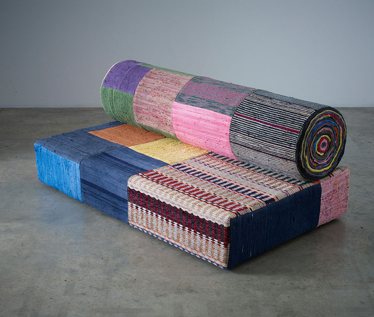 Tal R, Retired Professor, 2014. Rag rugs and foam on wood, Sofa: 83 × 200 × 118 cm; Top part: 48 × 200 × 48 cm. Victoria Miro, London/Venice.