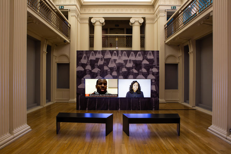 Kahlil Joseph, BLKNWS®, 2018–ongoing. Two-channel fugitive newscast, HD video on networked media players with Stereo Sound. Courtesy of Talbot Rice Gallery, University of Edinburgh. Photo: Sally Jubb.