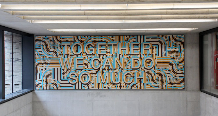 Mark Titchner. Together we can do so much, 2019.  Veneered and stained Valcromat. Installed Zayed Centre for Research into Rare Disease in Children, Great Ormond Street Hospital.